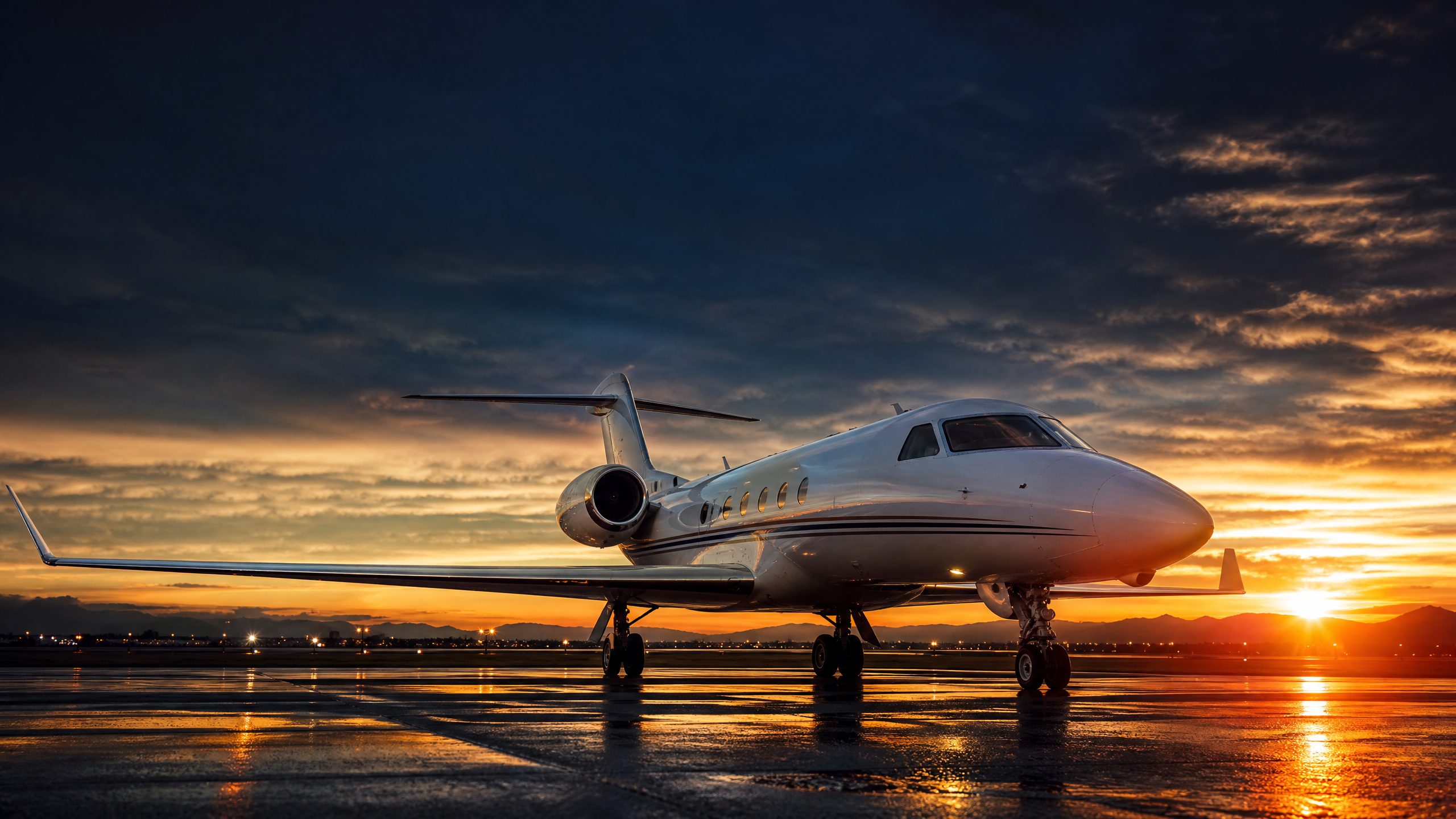 Business jet on wet tarmac at golden hour